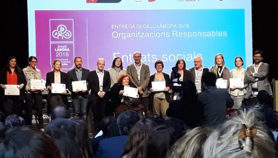 Suara Cooperativa y Garbet Cooperativa d’Inserció recogiendo el sello