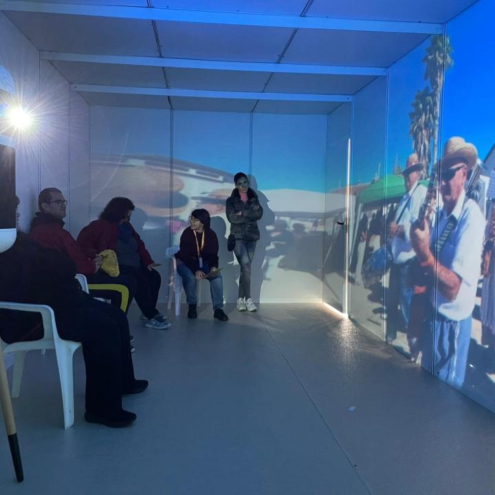 People enjoying a video in Suara’s immersive room.