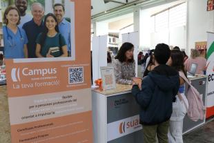 Suara’s stand at the Employment Fair with people requesting information