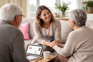 A professional supporting an elderly couple